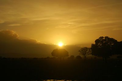 Scenic view of landscape at sunset