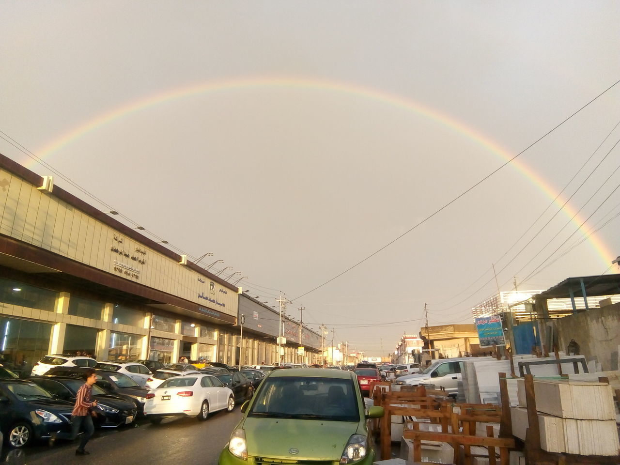 AERIAL VIEW OF RAINBOW OVER CITY STREET