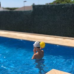 High angle view of woman swimming in pool