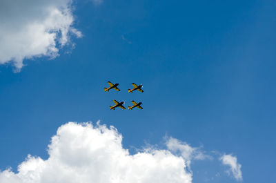 Low angle view of airplane flying in sky