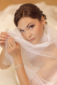 High angle portrait of bride wearing wedding dress