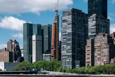 Modern buildings in city against sky