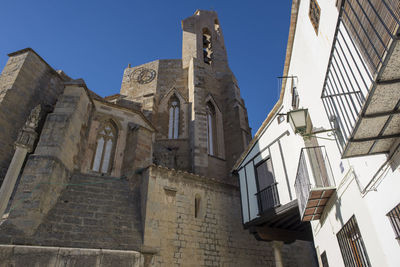 Low angle view of buildings against clear sky