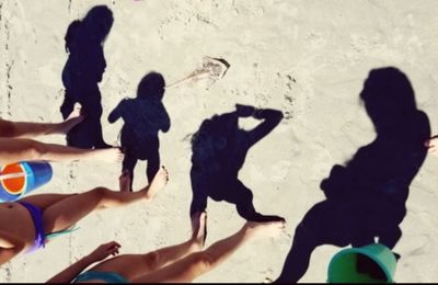 Shadow of people on beach