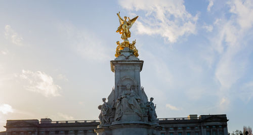 Low angle view of statue  against sky