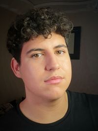 Close-up portrait of young man at home