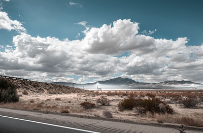 Road by land against sky