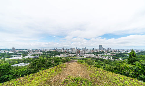 Panoramic view of city buildings against sky