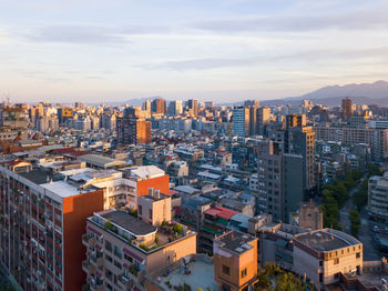 High angle view of buildings in city against sky