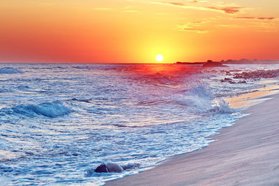 Scenic view of sea against sky during sunset