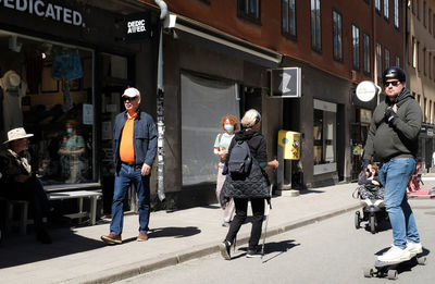 People standing on street in city