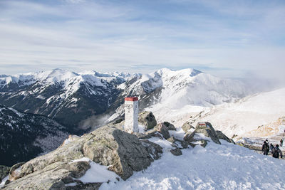 Scenic view of snowcapped mountains against sky