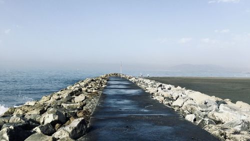 Pier over sea against sky. road to the sea