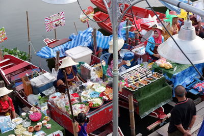 Group of people for sale at market stall