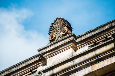 Low angle view of statue against sky