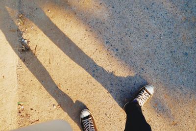 Low section of person standing on ground