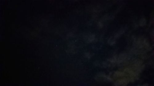 Low angle view of moon in sky at night