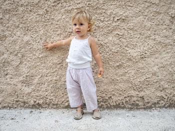 Portrait of cute girl standing outdoors