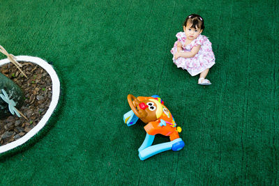 High angle view of baby playing with toy