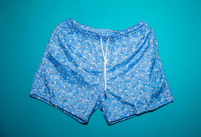 Close-up of shorts over colored background
