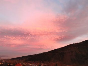 Scenic view of silhouette landscape against romantic sky at sunset