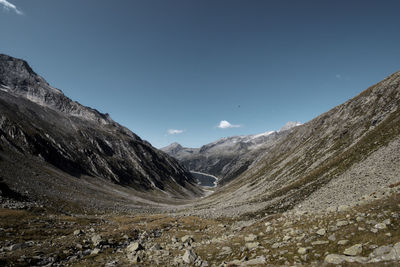 Scenic view of mountains against clear blue sky