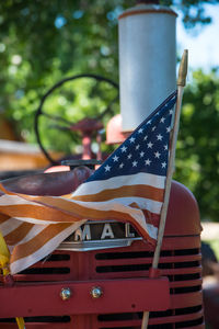 Low angle view of flags against trees