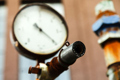 Close-up of pressure gauge in factory
