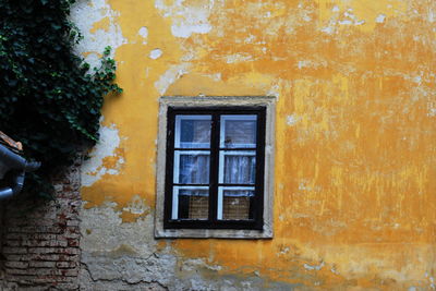 Close-up of yellow door of house