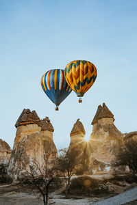 Low angle view of hot air balloons against sky in cappadocia 
