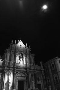 Low angle view of historic church against sky at night