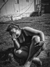 Girl relaxing on grassy field