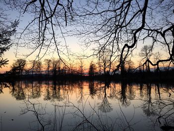 Scenic view of lake at sunset