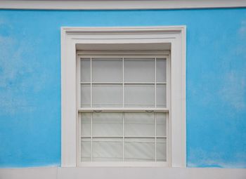 Closed blue door of building