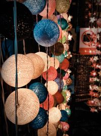 Multi colored toys for sale at market stall