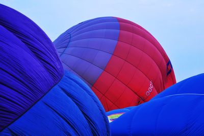 Low angle view of hot air balloon against blue sky