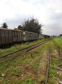 Train on railway tracks against sky