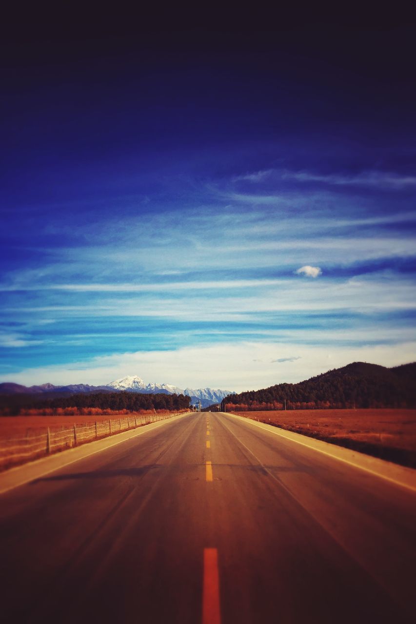 the way forward, transportation, road, diminishing perspective, road marking, vanishing point, country road, sky, landscape, tranquil scene, tranquility, empty, empty road, asphalt, cloud - sky, nature, scenics, mountain, non-urban scene, remote