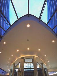 Low angle view of illuminated ceiling against sky