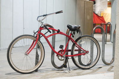 Bicycle against red wall