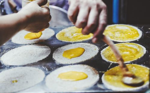 Close-up of person preparing food