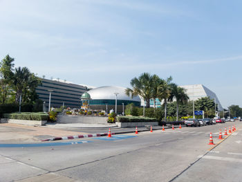 Road by building against sky