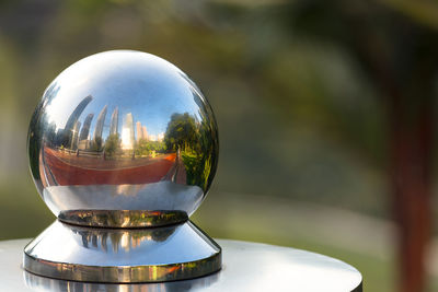 Reflection of city on metal ball