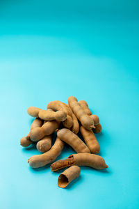 Tamarind was photographed on a light blue background.