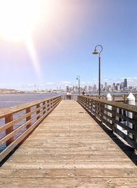 Pier over sea against clear sky