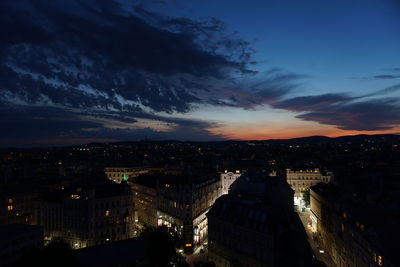 High angle view of buildings in city at night