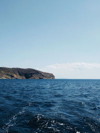 Scenic view of sea against blue sky