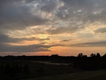 Scenic view of silhouette landscape against sky during sunset