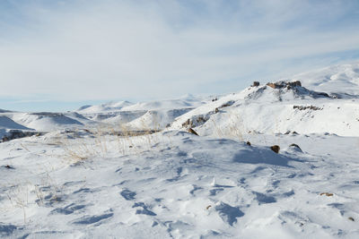 Scenic view of snow mountains against sky