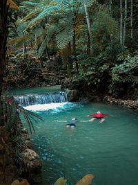 People swimming in sea